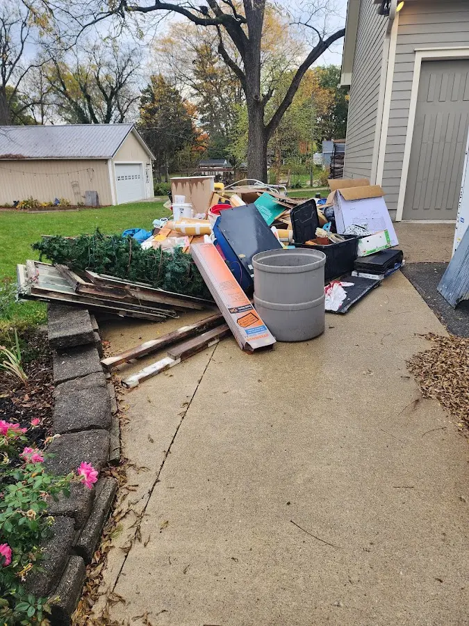 Dumpster being loaded with debris for 3 Yard Dumpster Rental in South Burlington